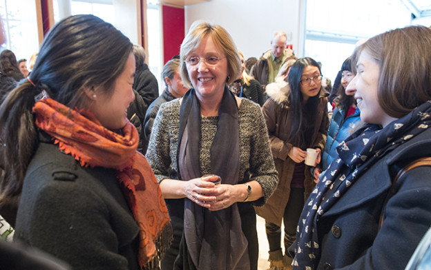 Smith College President Kathleen McCartney talks with female students.